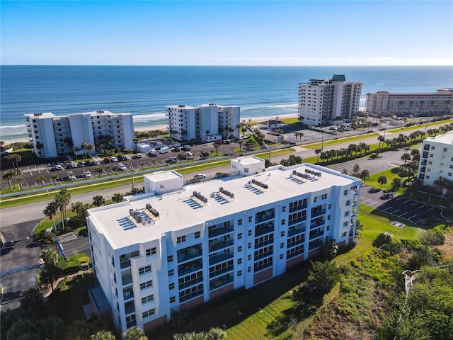 bird's eye view with a water view and a view of the beach