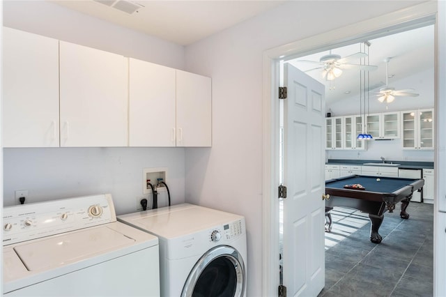 clothes washing area with washer and clothes dryer, cabinets, sink, ceiling fan, and pool table