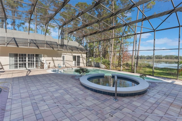 view of swimming pool featuring an in ground hot tub, a patio, a water view, and glass enclosure