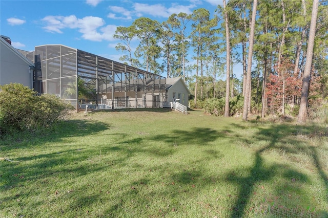 view of yard with glass enclosure