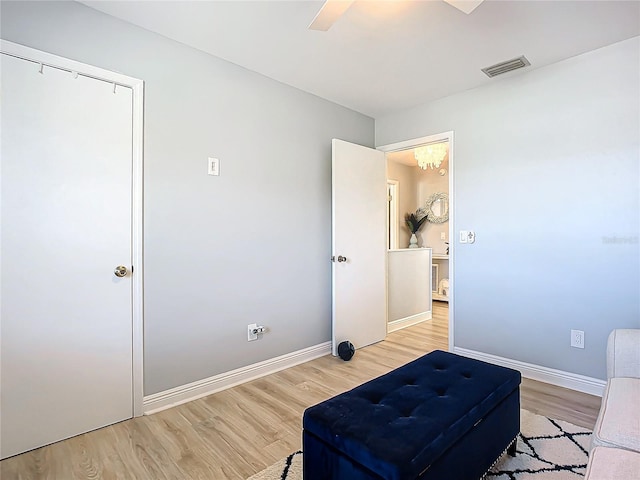 bedroom featuring light hardwood / wood-style flooring, a closet, and ceiling fan