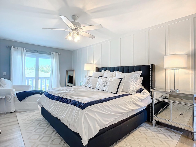 bedroom with light wood-type flooring and ceiling fan