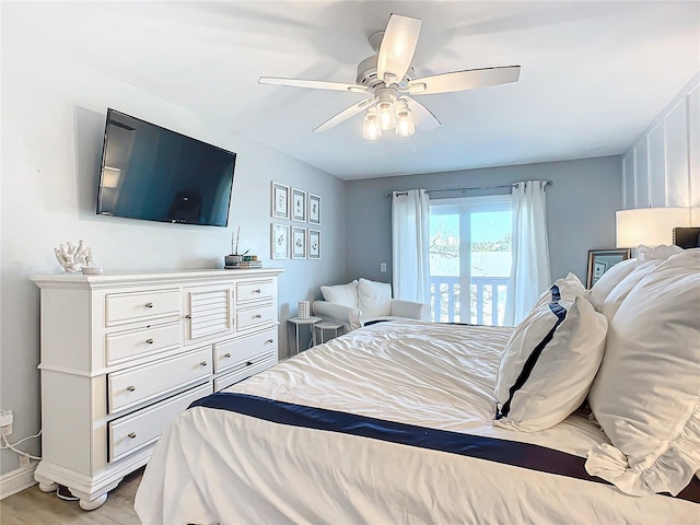 bedroom with ceiling fan and light hardwood / wood-style floors