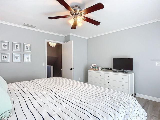 bedroom featuring crown molding, light wood-type flooring, and ceiling fan