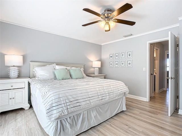 bedroom with crown molding, light hardwood / wood-style flooring, and ceiling fan