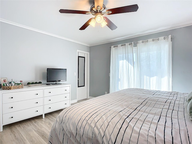 bedroom featuring ornamental molding, light wood-type flooring, and ceiling fan