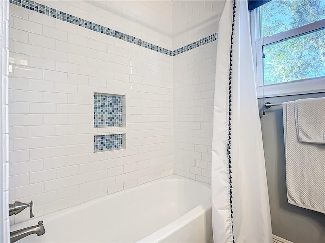 bathroom featuring shower / bath combo with shower curtain