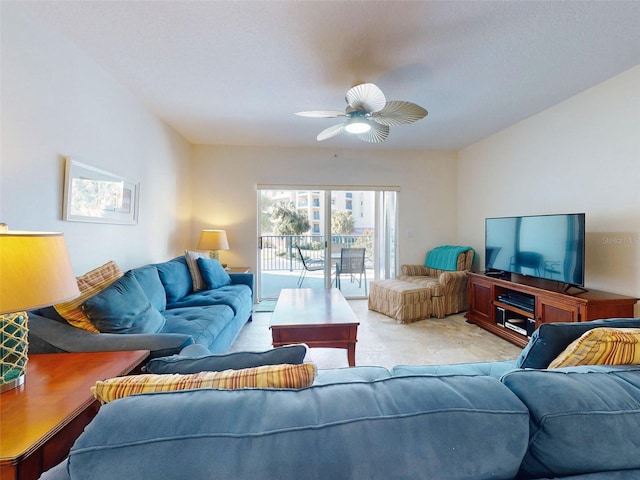 carpeted living room with ceiling fan