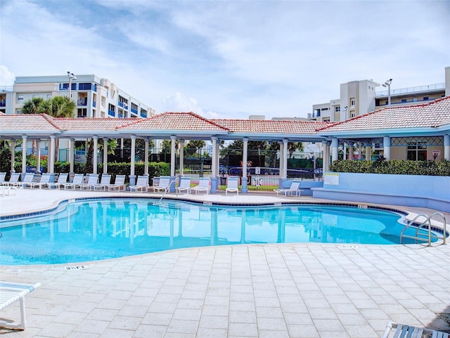 view of swimming pool with a patio