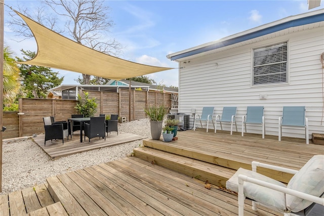 wooden deck with central AC unit