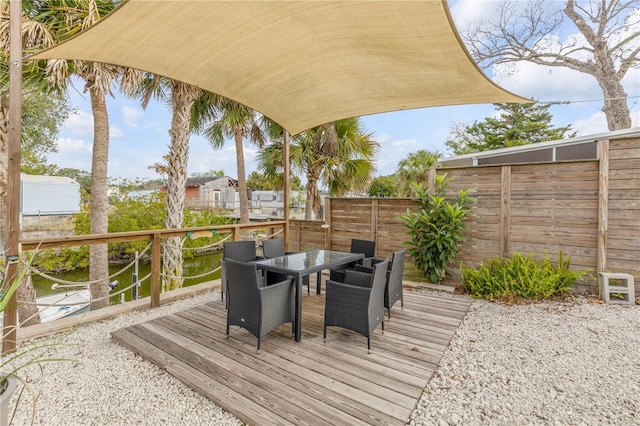 wooden deck featuring a water view