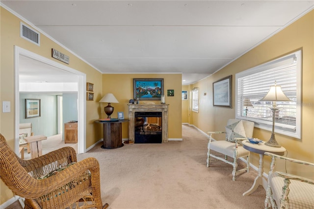 living room with a multi sided fireplace, carpet, and crown molding