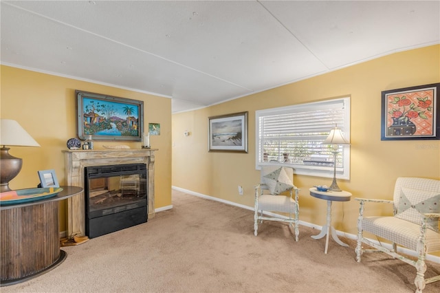 sitting room with light colored carpet and crown molding