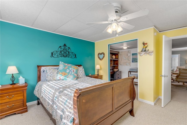 bedroom with ceiling fan and light colored carpet