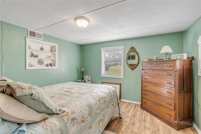 bedroom featuring light hardwood / wood-style floors