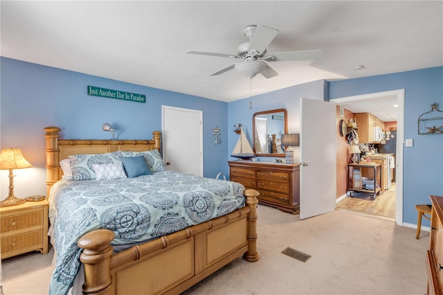 bedroom with light colored carpet and ceiling fan