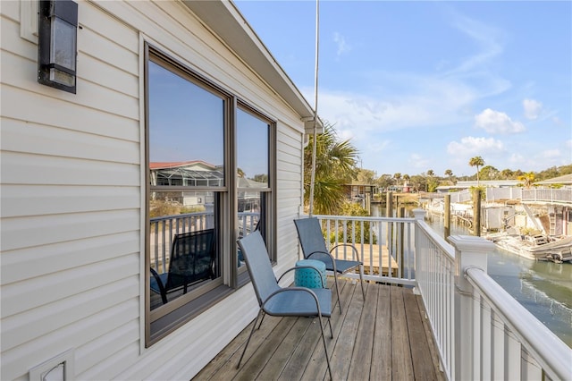 wooden deck featuring a water view