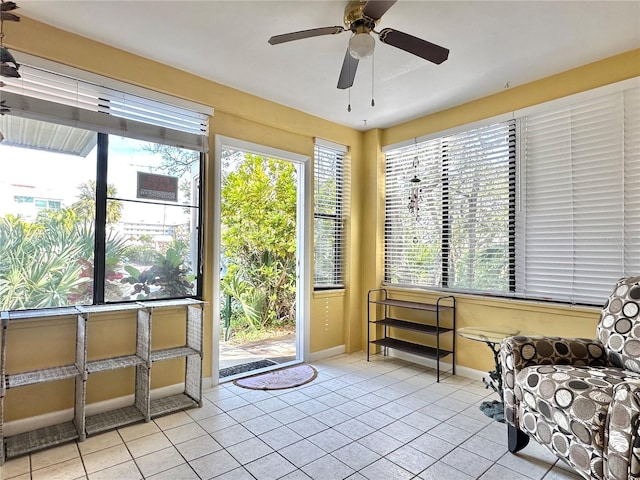 sitting room featuring ceiling fan, a healthy amount of sunlight, and light tile patterned floors