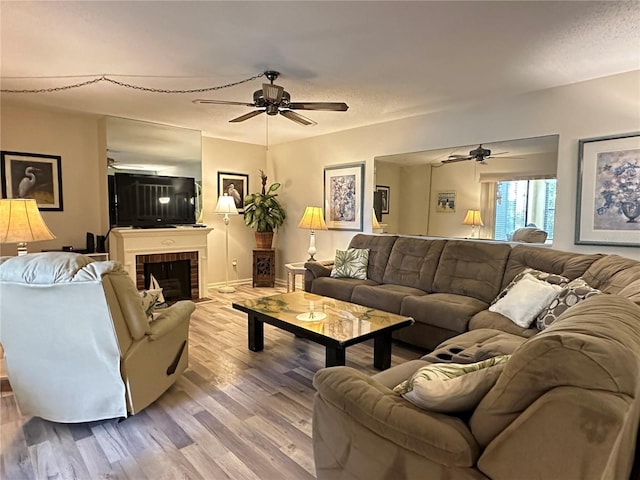 living room with a fireplace and hardwood / wood-style flooring