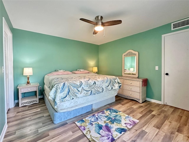 bedroom featuring light hardwood / wood-style flooring and ceiling fan