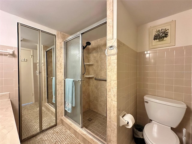 bathroom with walk in shower, tile patterned flooring, toilet, and tile walls