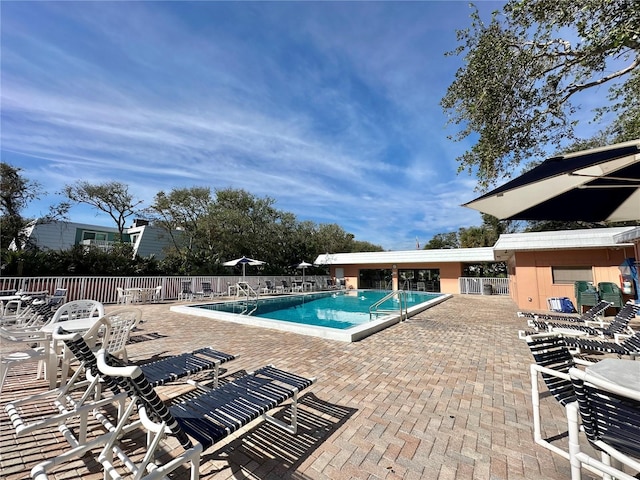 view of swimming pool with a patio area