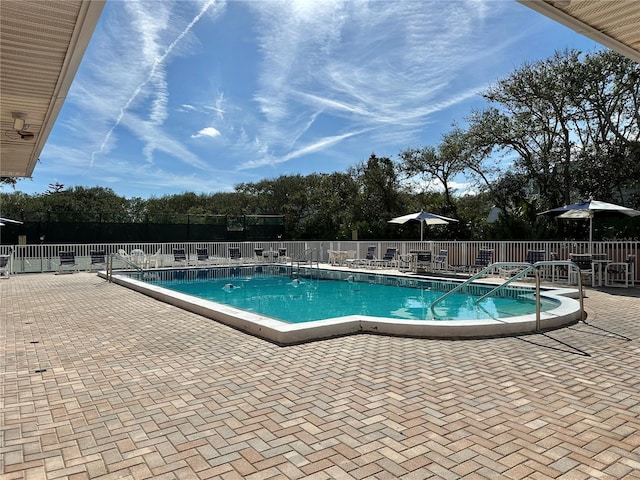 view of swimming pool with a patio