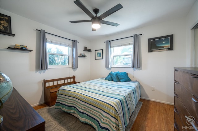 bedroom featuring hardwood / wood-style floors and ceiling fan