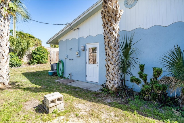 view of property exterior featuring a lawn