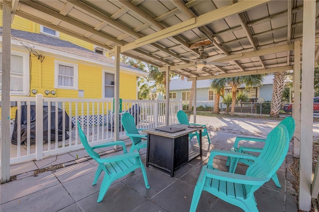 view of patio with a fire pit