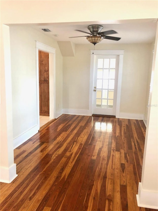 unfurnished room with ceiling fan and wood-type flooring