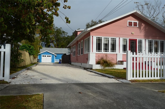 view of front of house with an outbuilding and a garage