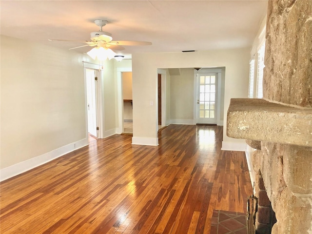 interior space with ceiling fan and wood-type flooring