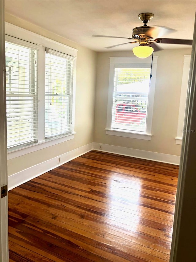 spare room featuring ceiling fan and wood-type flooring