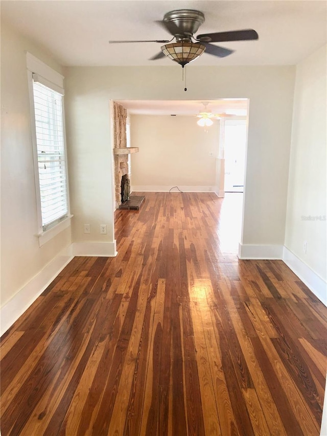 corridor with dark hardwood / wood-style floors