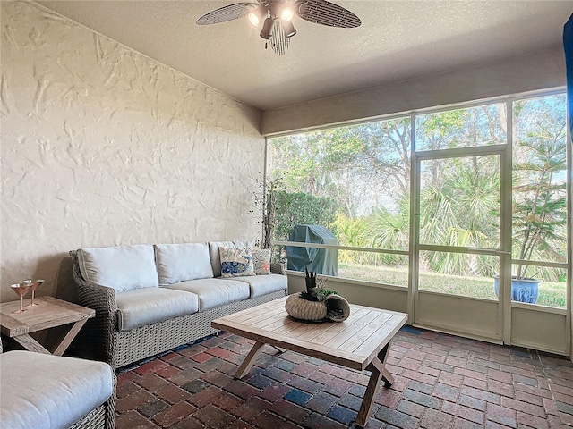 sunroom featuring plenty of natural light and ceiling fan