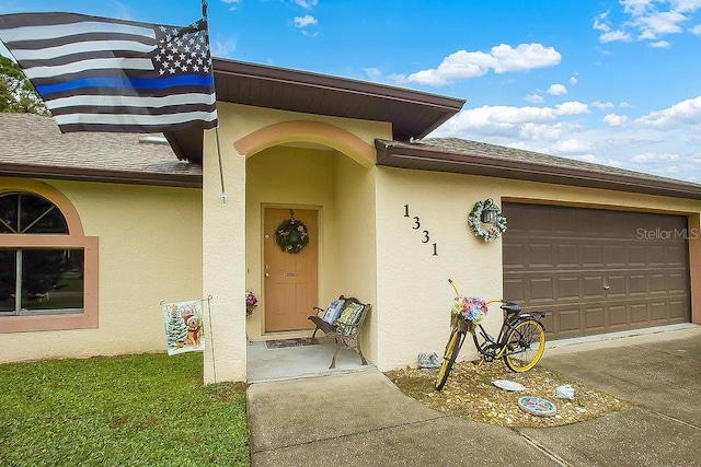 doorway to property featuring a garage