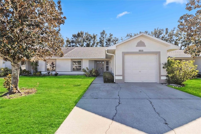 ranch-style home featuring a front yard and a garage