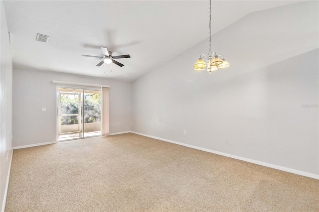 spare room featuring carpet, ceiling fan with notable chandelier, and lofted ceiling