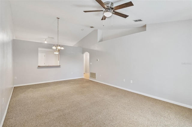 unfurnished living room with ceiling fan with notable chandelier, lofted ceiling, and carpet floors