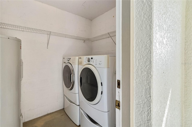 laundry area featuring separate washer and dryer and electric water heater