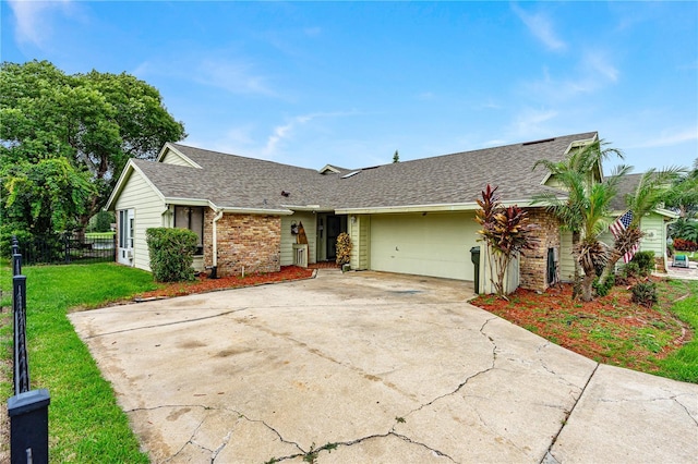 ranch-style house with a front yard and a garage