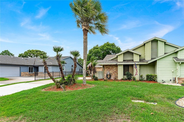 view of front facade featuring a garage and a front lawn