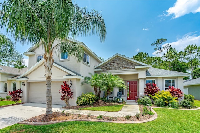 view of front of house with a front yard and a garage