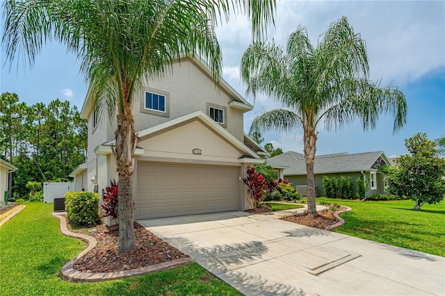 view of front of house with a front lawn and a garage