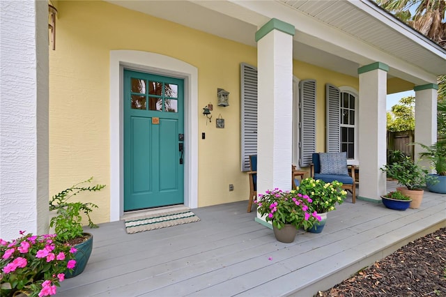 property entrance featuring a porch