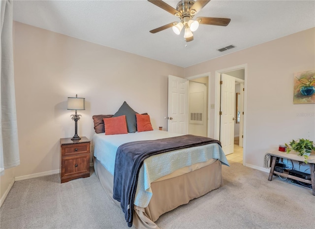 bedroom with light colored carpet and ceiling fan