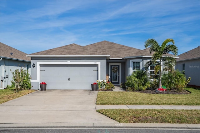 ranch-style home featuring a garage and a front lawn