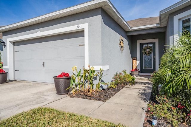 doorway to property featuring a garage