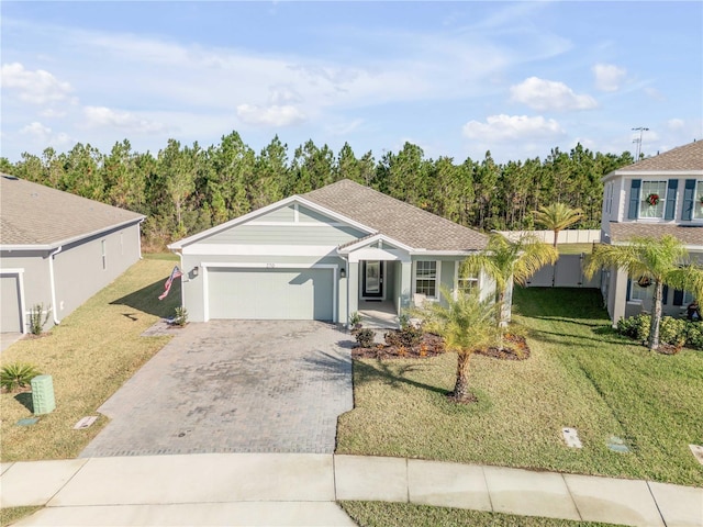 ranch-style home with a front lawn and a garage